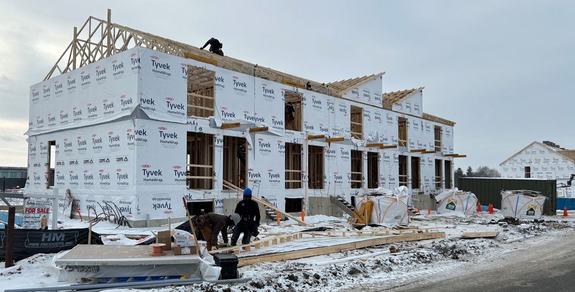 Row houses under construction in Komoka by developer Design for Happiness.